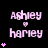 Pixelated pink text 'Ashley' above 'Harvey' with a small heart symbol between them, surrounded by pink heart symbols on a black background.