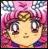 Pixelated image of a character with large eyes, pink hair, and a yellow face against a checkered background.