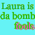 Pixelated green text on cyan background reads 'Laura is da bomb' with 'bomb' in pink and brown gradient, all rendered in blocky 8-bit style.
