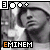 A 4x4 contact sheet of a black-and-white animated icon featuring Eminem with the text "EMINEM" in orange and white, showing frame-by-frame animation changes across 14 sampled frames.