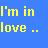 Pixelated blue background with yellow and green text reading "I'm in love.".