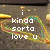 Pixelated text reads 'i kinda sorta love u' over a blurred multicolored background with yellow and green hues.