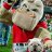 Pixelated image of a light-colored dog wearing red clothing, standing against a blurred green and blue background.