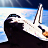 Pixelated image of a space shuttle in flight against blue sky and white clouds, with visible engine exhaust.