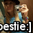 Pixelated image of two figures with one holding a camera, overlaid with large white text reading 'pestie:]' on a black background.