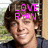 A pixelated image of a person with brown hair wearing a dark shirt, showing two sequential text overlays: 'I LOVE RYAN' and '<3333'.
