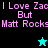 Pixelated text reads "I Love Zac But Matt Rocks" with a cyan star on black background and a black star on cyan background.
