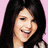 A pixelated image of a person with long dark hair against a pink background, with the name "Selena" displayed in white text at the bottom.