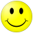 Yellow circular face with black oval eyes and a curved black smile on a gray background.