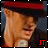 A pixelated figure with light skin and dark hair wears a red headband and dark clothing, with red 'JT' text in the bottom right corner.