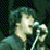 A 3x3 contact sheet of animated frames from a Green Day-themed AIM buddy icon featuring pixelated images of band members and text that builds the phrase "Yeah, he's my HUSBAND He just doesn't KNOW it yet."
