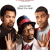 Static pixelated image of three people in a group pose with one person holding up two fingers, wearing casual clothing and a cap with red/blue accents.