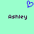 A static pixel art icon with a light green background, featuring a blue heart symbol above two instances of the name 'Ashley' in dark purple text.