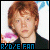 Four pixelated character portraits arranged in a with blue text reading "R2D2E FAN" beneath each, set against a blurred background of pink and white shapes