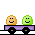 Pixel art train with purple cars and black wheels, carrying two smiling faces on gray background.