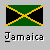 Pixelated flag with green top and bottom triangles, black diagonal X-shaped bands bordered by yellow stripes on gray background.