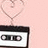 Pink background with a cassette tape and heart outline, text reading "I Am A Music Addict" in pixelated white font.
