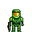 Pixel art of a green armored figure with orange-yellow visor, holding a brown and beige weapon against gray background.