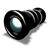 Pixelated black cylindrical object with a reflective lens surface showing white and teal highlights, positioned diagonally on a gray background.