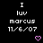 Pixelated text and heart symbols on a black background with a gray corner, showing repeated patterns of 'I luv marcus 11/6/07' and pink hearts.