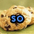 A chocolate chip cookie with blue text overlays changing from 'so' to 'good' then to three exclamation marks.