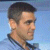 Static pixelated image of a man's profile with short dark hair against a light blue background, rendered in low-resolution style typical of early 2000s buddy icons.