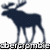 Pixelated dark blue moose stands facing left with large antlers, legs slightly apart, on white background with black text below.