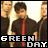 A 3x3 contact sheet of animated frames showing a group of people in black shirts and red ties with "GREEN DAY" text overlay, displayed on a gray background.