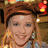 Three distinct pixelated portraits of smiling individuals in separate , each with unique clothing and background elements