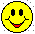Nine yellow circular faces with black eyes and red mouths display varied expressions including smiling, winking, and tongue-out poses against a gray background.