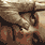 A static image of a stone relief sculpture with text "THE HILLS HAVE EYES" in brown serif font on light beige background.