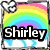 Pixelated icon with rainbow gradient background, white cloud-like shape in top-left, and bold black-and-white text reading "Shirley" across the center.