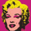 Pixelated portrait of a person with blonde hair against a solid pink background, featuring closed eyes and visible makeup.