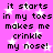 Pixelated text on a pink background with white stars, repeating 'it starts in my toes makes me crinkle my nose!' twice.