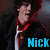 A person with curly brown hair wears a black jacket over red and white clothing, shown in four with slight pose changes