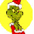 Green cartoon character with large eyes and black nose wearing red Santa hat and matching red boots against yellow circular background.