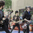 A four- shows a group of people in various poses with red text reading 'Fall Out Boy' at the bottom right
