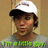 Pixelated image of a person wearing a white cap and gray shirt with green text, surrounded by pink pixelated text on black background.