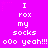 A static image with a bright pink background displays repeated white pixelated text in a pattern