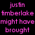 Pixelated image with pink text on black background and a small photo of a person with curly hair, wearing dark clothing with a purple heart symbol.