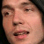 Pixelated close-up of a person's face showing eyes, nose, mouth, and partial forehead with visible teeth and lips.