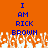 Static pixel art displays blue text 'I AM RICK BROWN' on orange background with white pixelated tree-like shapes at bottom.