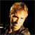 A 50x50 pixel animated buddy icon split into two frames showing a person's face on the left and green text on the right against dark backgrounds.