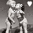 Black-and-white pixelated animation of two figures in a romantic pose with heart symbols and text overlays.