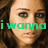 A pixelated image of a person with brown hair and blue eyes, overlaid with green text reading "i wanna" on the left side.
