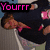A pixelated animation of a person in dark clothing with pink accents, showing sequential text overlays and facial expressions.