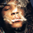 A pixelated close-up of a person with long dark hair and closed eyes, showing subtle facial expression changes across frames.
