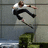 A pixelated image shows a person in mid-air with arms outstretched against a gray tiled background, next to bold red text reading "Ryan Sheckler".