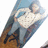 A person in a white patterned shirt and blue pants lies on a blue surface with a brown floor background, next to pink text reading "LeOnShIA 4 Ho fRIEnDs HeLeN 4 yA ByTcH".