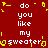 Red background with white text reading "do you like my sweater" repeated twice, surrounded by yellow pixelated shapes.